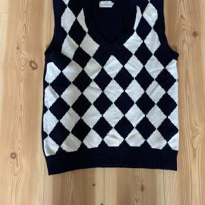 New knit vest with V neck , dark blue with white