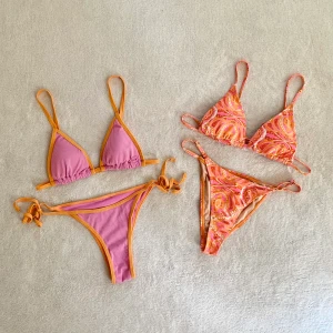 Bikinis - Rosa/orange bikini från Pull & Bear som kan justeras i midjan och har inlägg som kan tas ut! Använd någon enstaka gång och är tvättad 💛ORANGEA SÅLD