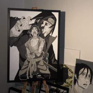 Drawing of the naruto characters itachi and sasuke on thick paper with the size 70cm x 50cm put in black Ikea frame