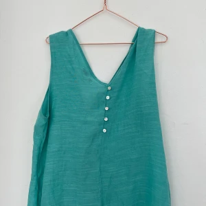 Blus - Fin sommar  blus i turkos, utan storlek. Men passar S/M