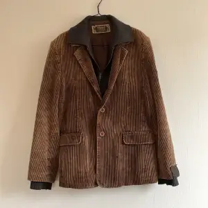 Brown blazer, with two patches on the side.