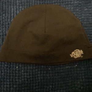 Syna world mössa - Mycket bra skick med bra pris