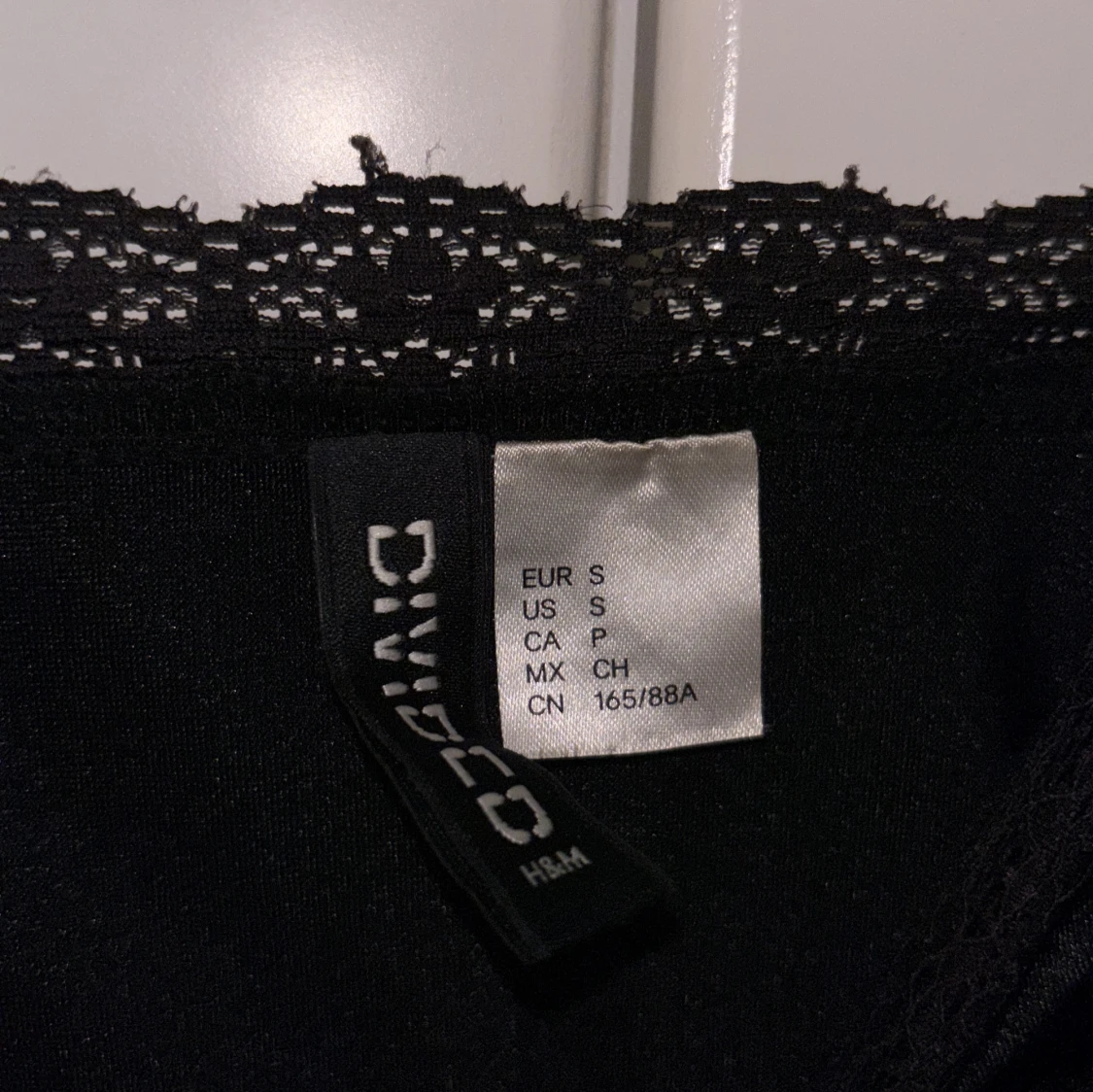 Svart satinlinnetopp med spets H&M - 2