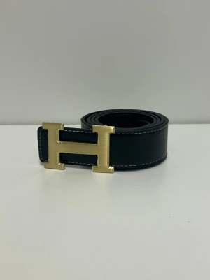 Herme's Bälte  - Helt ny aldrig använd. Storlek 110. Snabb frakt fraktar inom 24h.