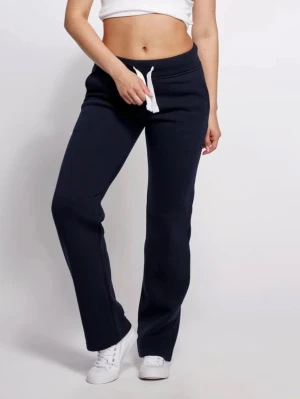 Mörkblå Russemerch byxor - Mörkblå mjukisbyxor från Russemerch i storlek XS. Byxornas snörning har blivit något blå aktig i tvätten tyvärr! I övrigt är dom i bra skick