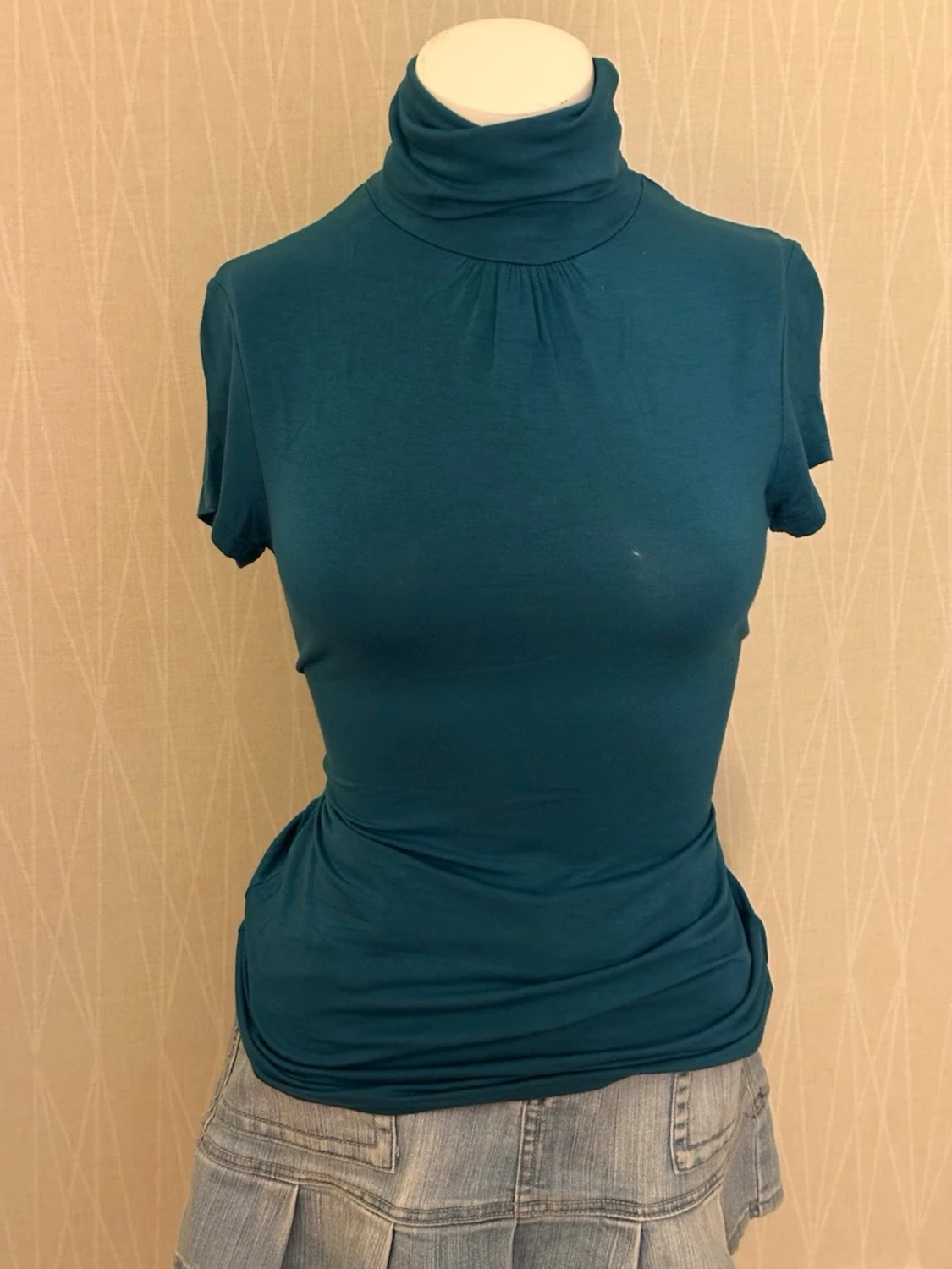 Mörk petrol polotopp i mjukt tyg