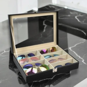  svart förvaringsbox -  svart box med glaslock och vita sömmar. Perfekt för dig som vill ha koll på dina shades och byta stil efter humör.