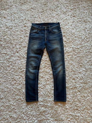 Nudie jeans tape ted vintage denim - Snygga jeans från nudie i modellen tape ted, jeansen är i toppskick utan defekter. Storlek W27 L32. Tveka inte på o skriva vid fler frågor!
