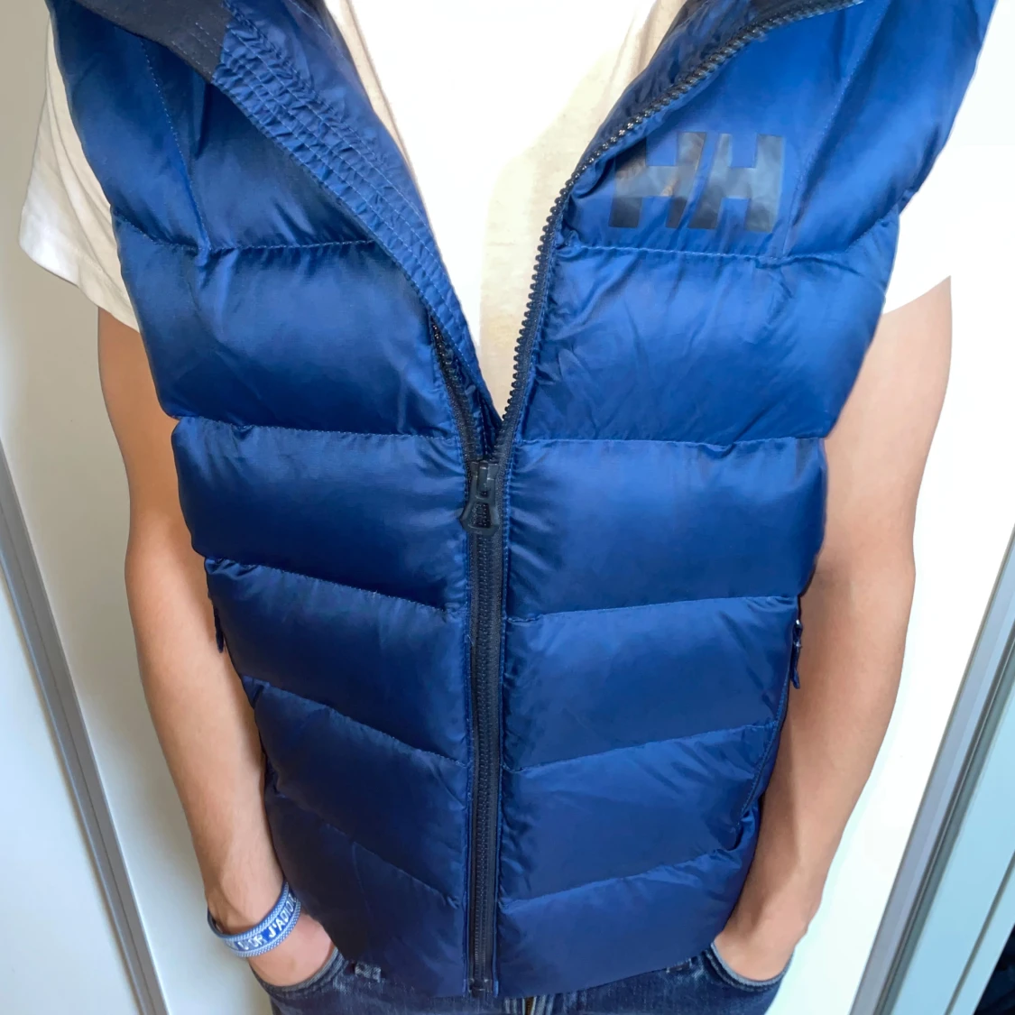 Blå dunväst från Helly Hansen