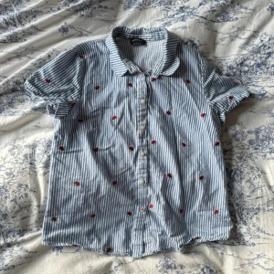 kookai ladybug blouse - has a little flaw by the collar, but very subtle (see photo)  marked as 38 but fits a size 34 and 36 best