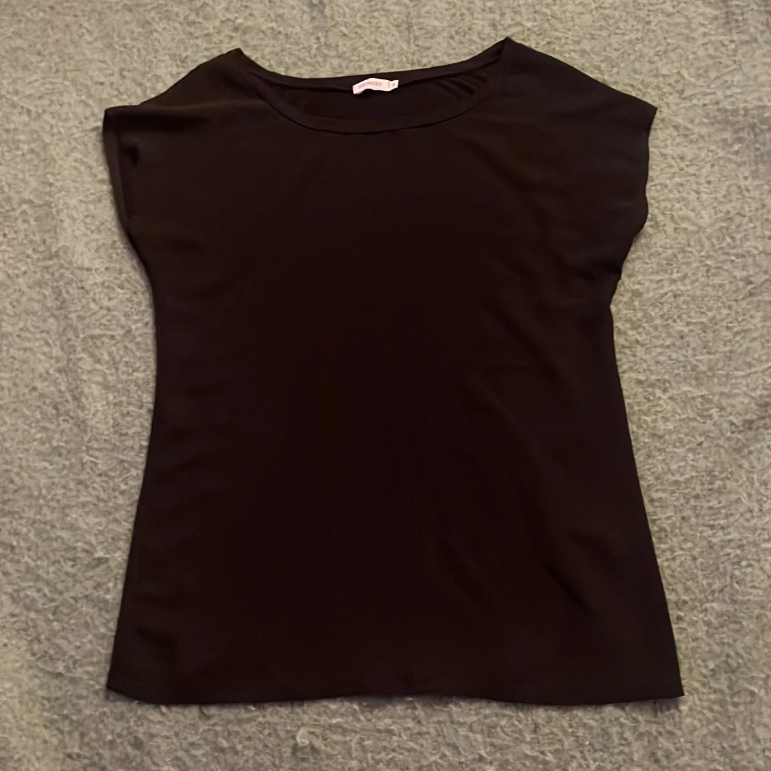 Svart linnetopp från Size & Needle