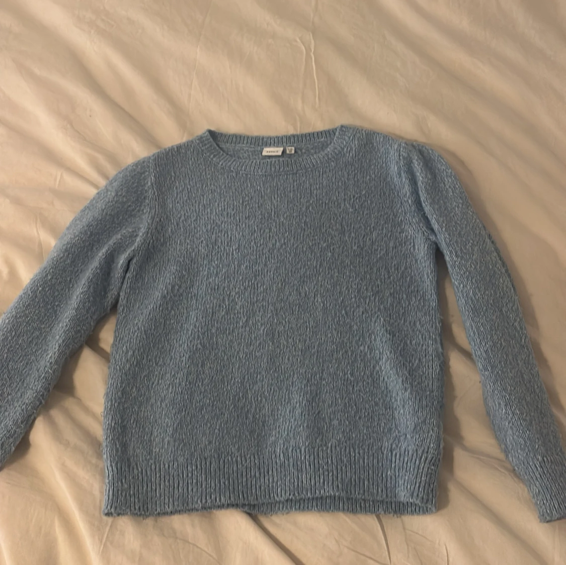 Ljusblå stickad tröja från Name It