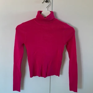 Rosa polotröja  - Aldrig använt. Prislappen sitter kvar 