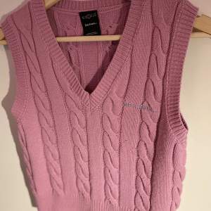 Iets Frans urban outfitters own brand pink cable knitted vest. 