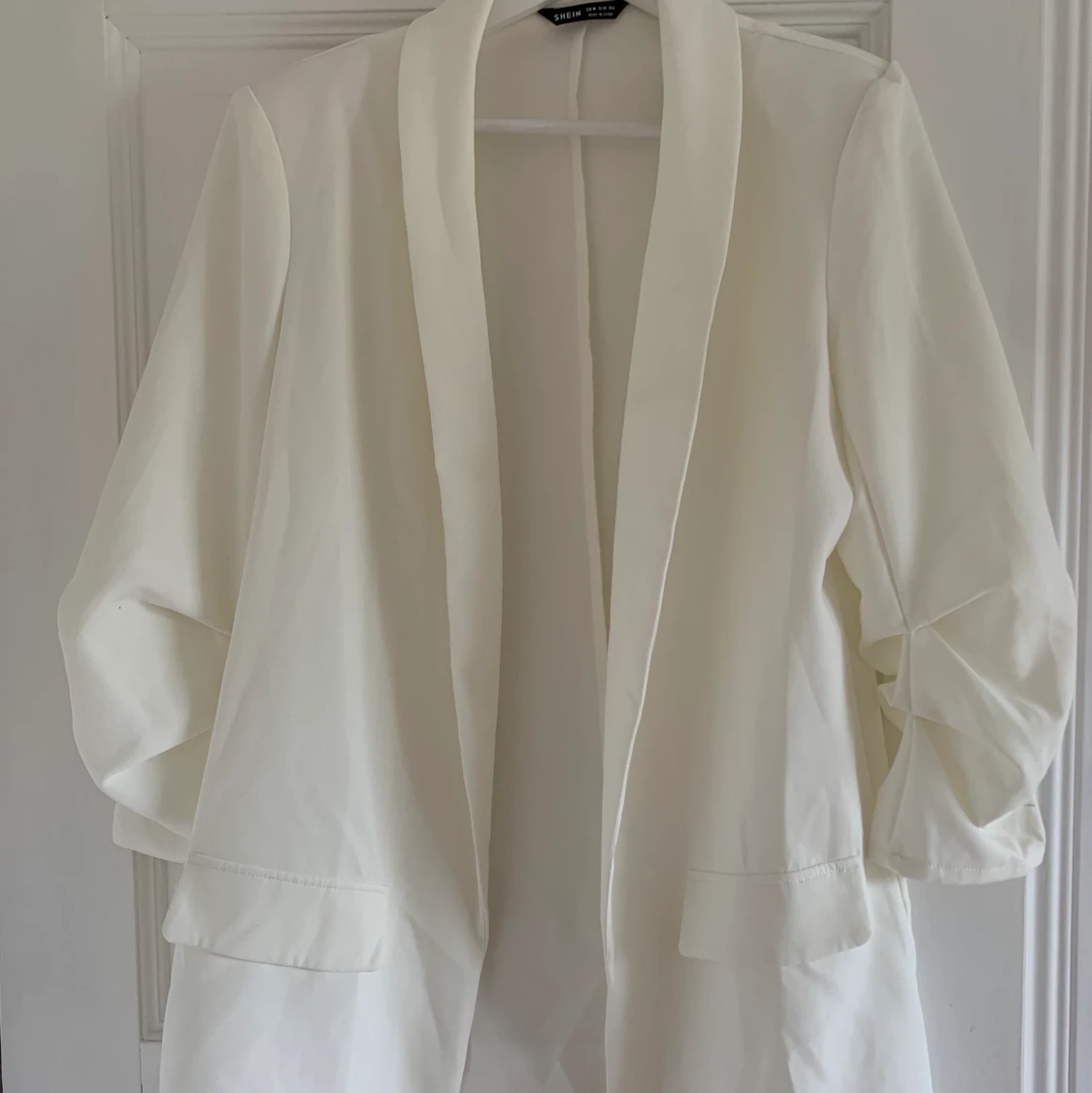 Vit kavaj i storlek M 