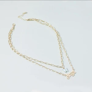 ”Angel” halsband i guld  - Fin accessoar 