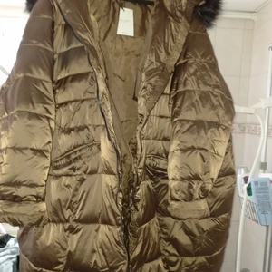 Vinterjacka - Underbart lätt härlig jacka som man bara kan dyka in i. Varm, lätt och skön. 