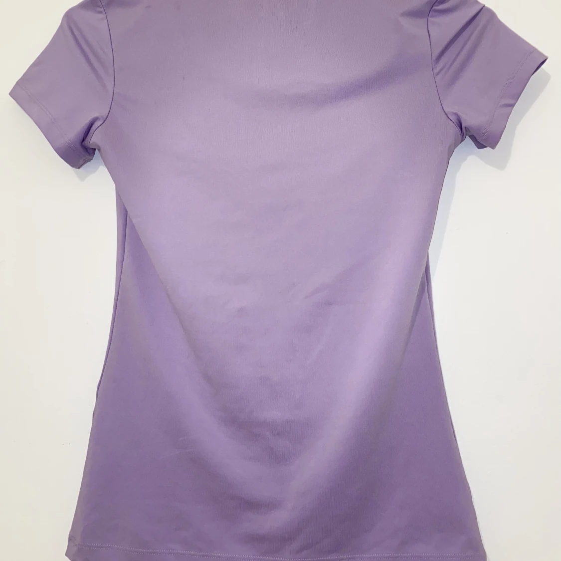 Lila tajt topp - 90