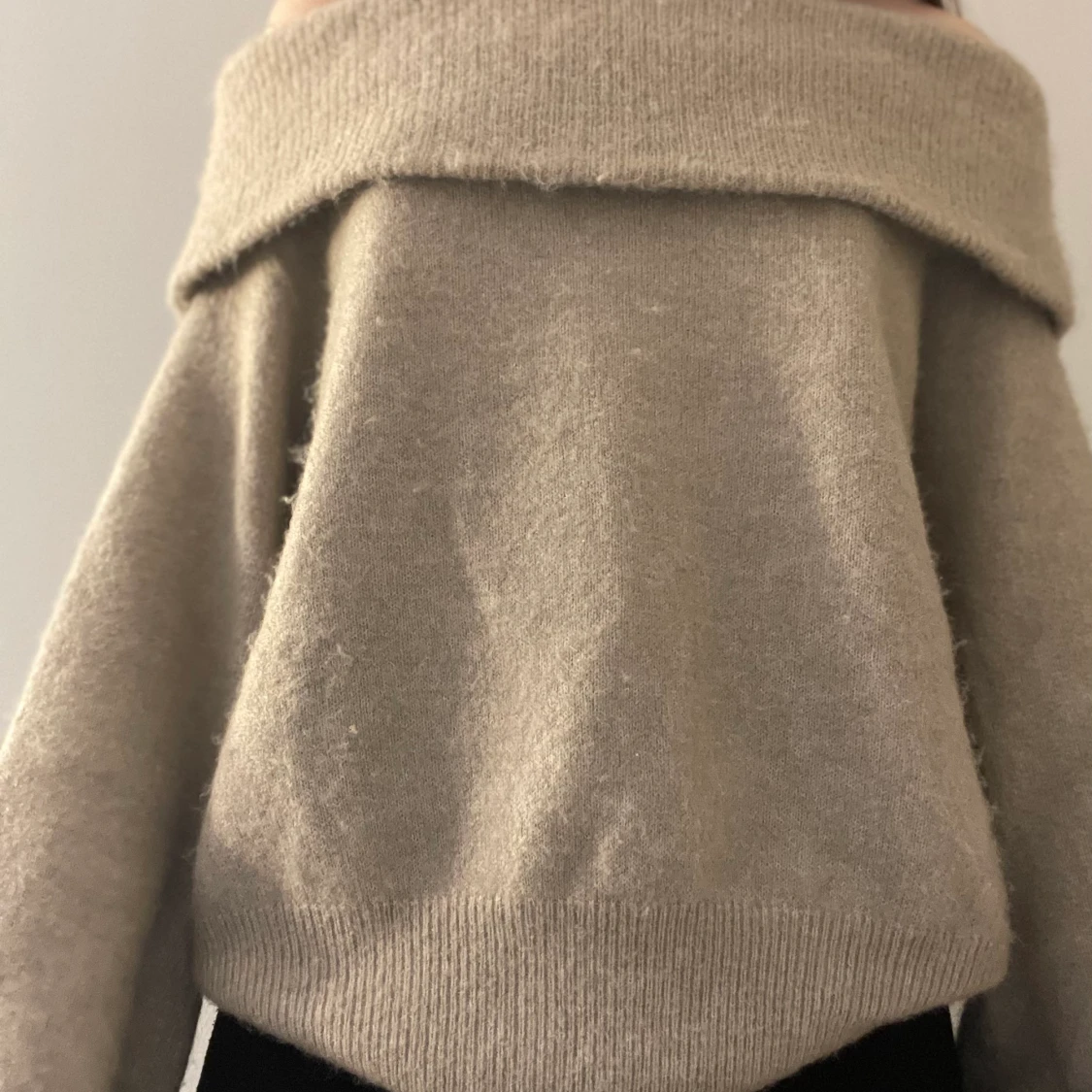 En beige stickad tröja