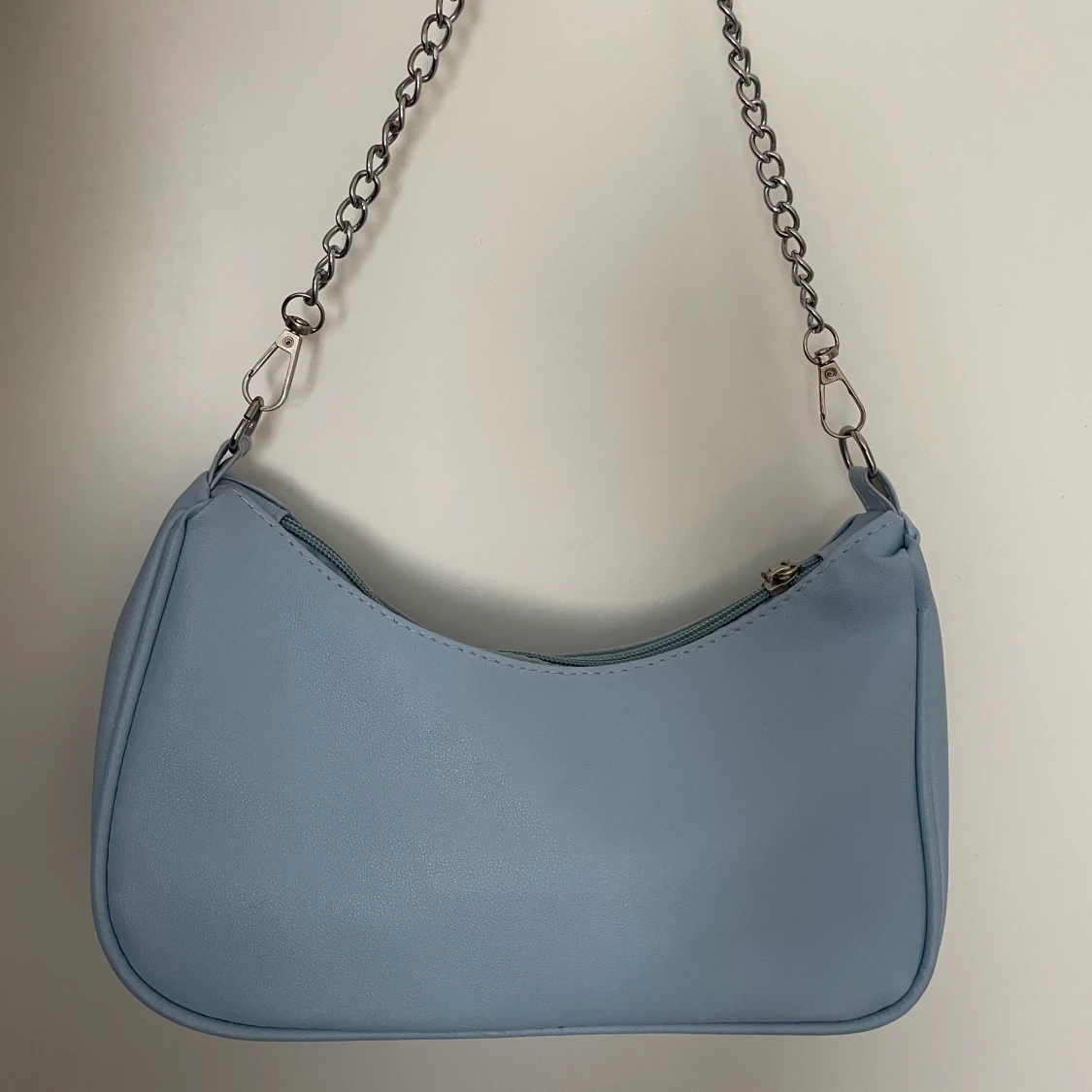 Ljusblå axelväska