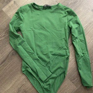 Body  - Grön body aldrig använd. St S 