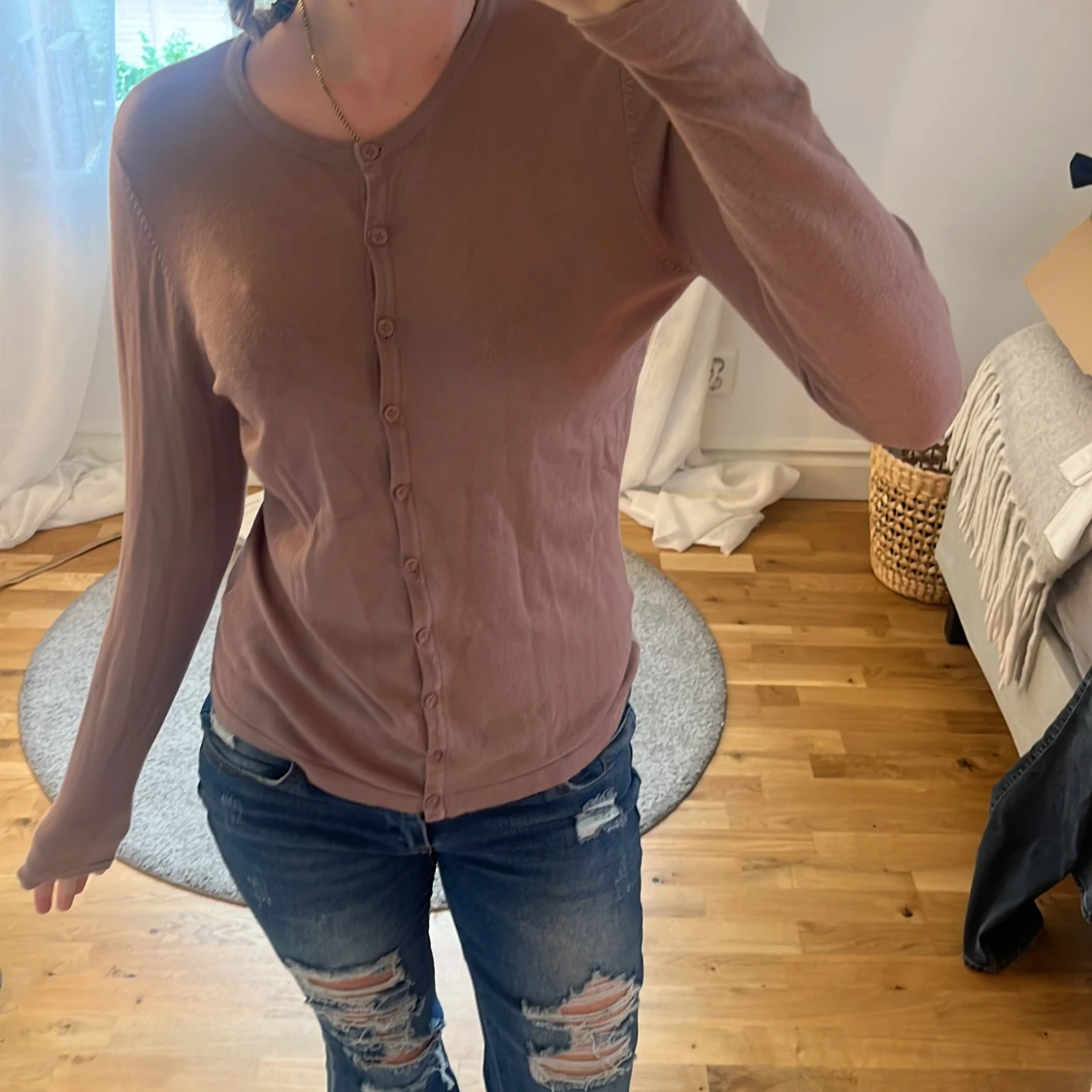 Rosa kofta med knappar