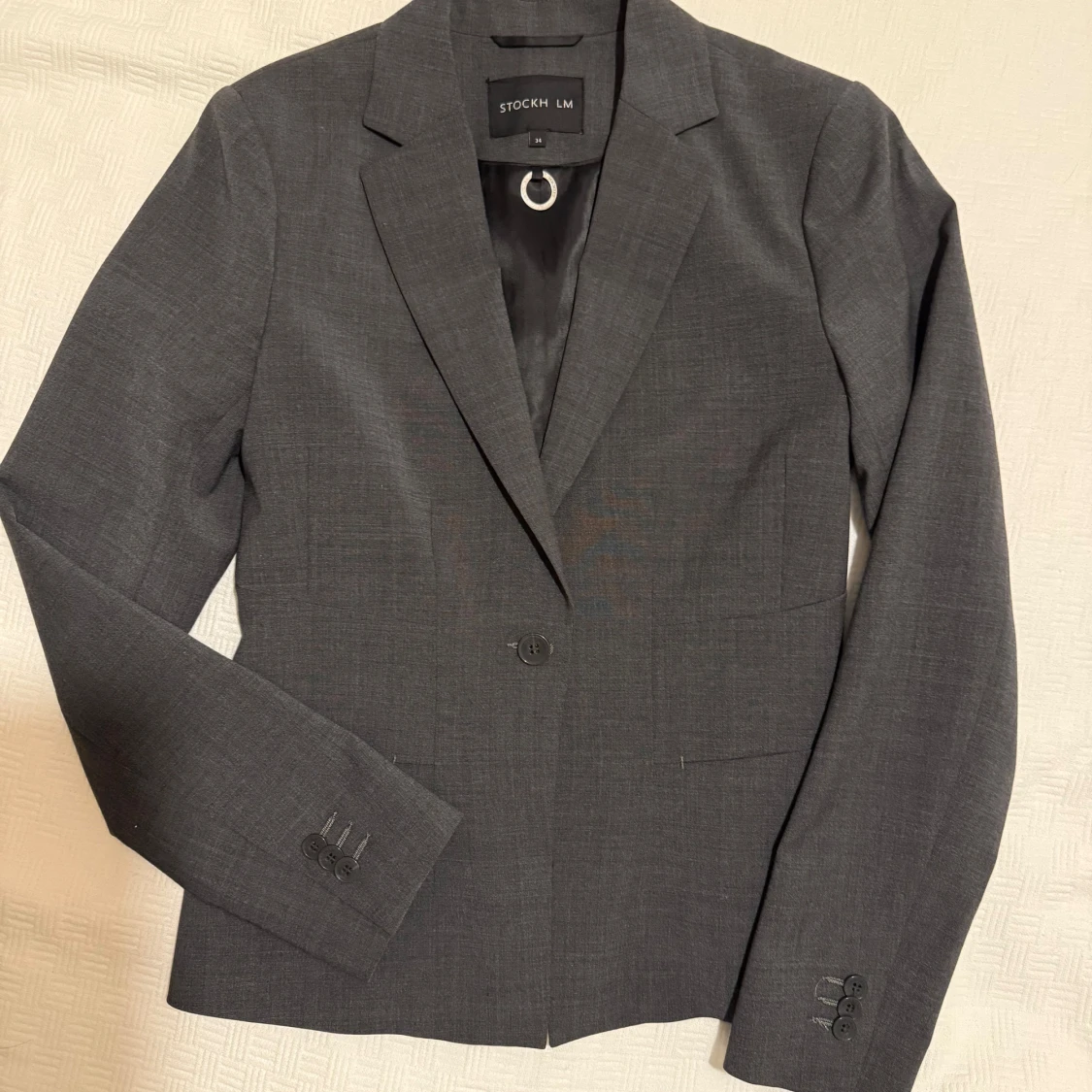 Mörkgrå kavaj från STOCKH LM, stl 34