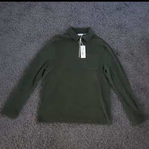 Half zip - Brothers frotté grön half zip. Storlek S