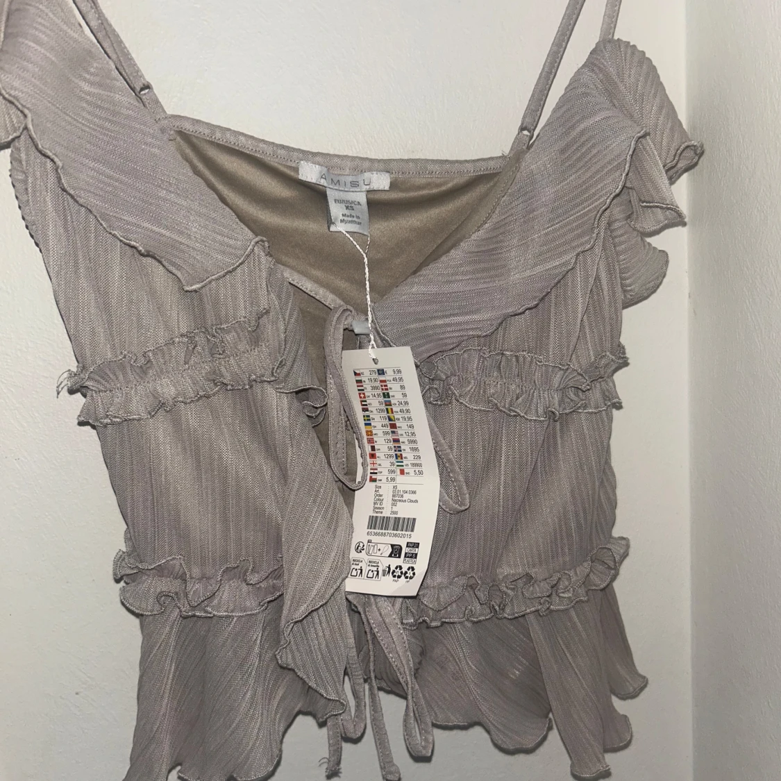 ljusgrå volang topp 