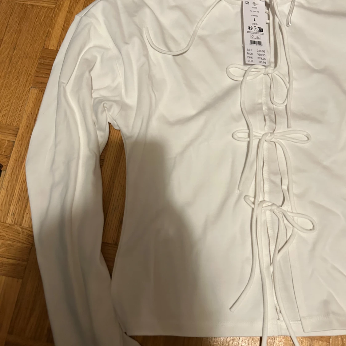 Vit långärmad topp med snörning Gina Tricot - 1