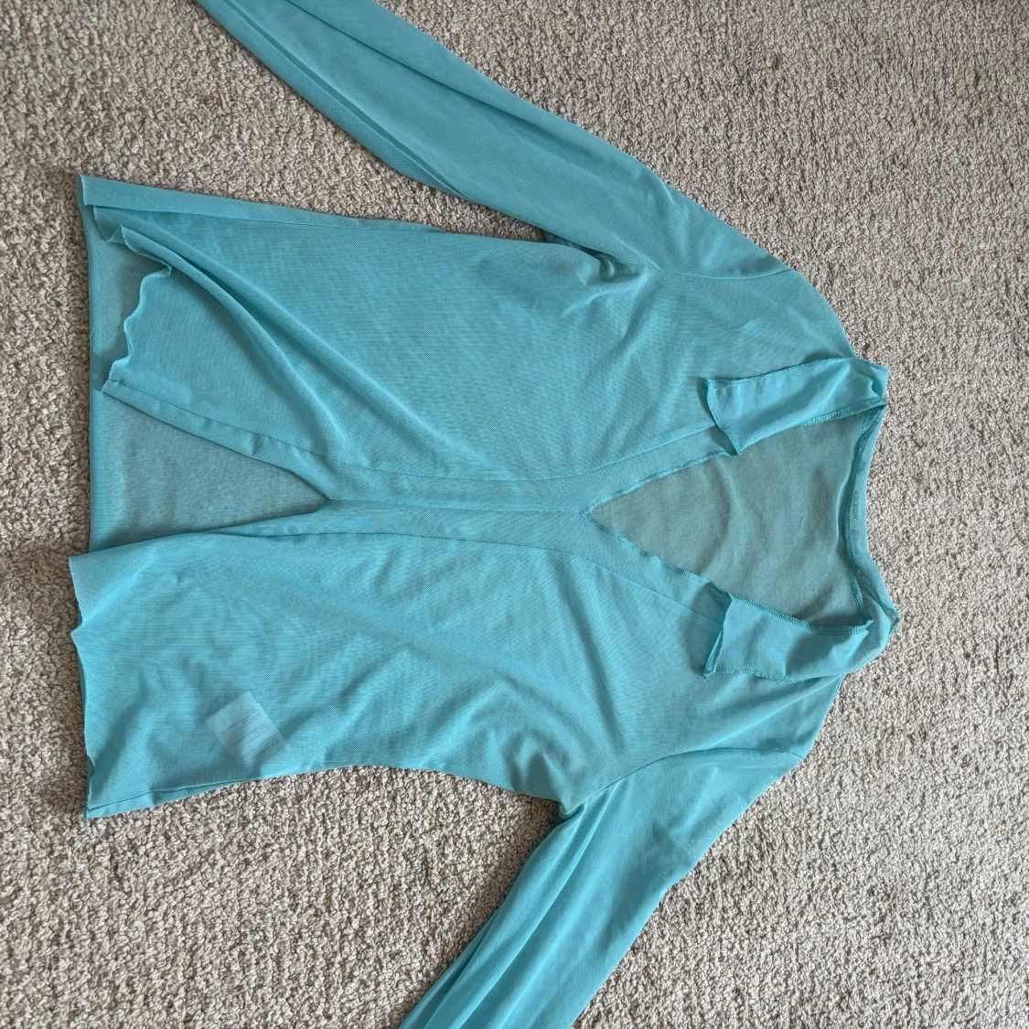 Turkos mesh topp med v-ringning