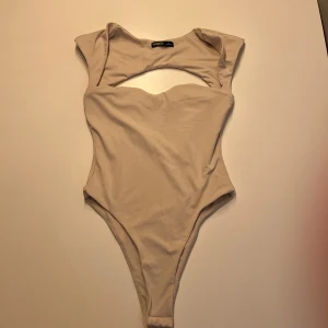 bodysuit - aldrig använd.