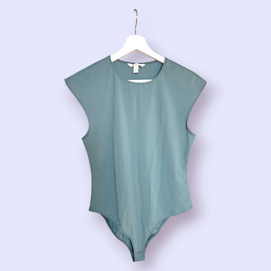 Grön body i storlek L från H&M