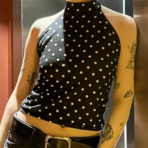 Anemone - Anemone halter neck top in black and white polka dots. Available in size XS, S and M 300SEK