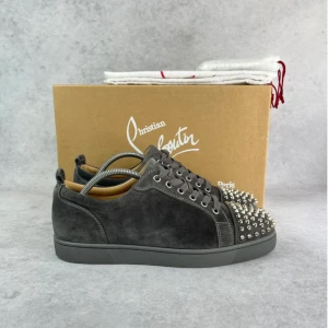 Christian Louboutin junior spike sneaker - – Condition: 9,5/10 - used twice  – Color: Grey  - What is included: Box & dustbags  – Retail price: 9000 + SEK