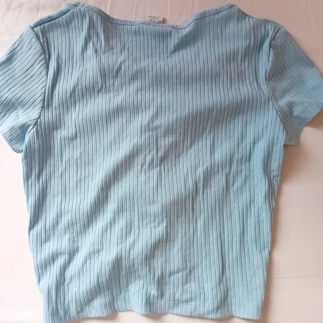 Ljusblå ribbad topp från Lindex