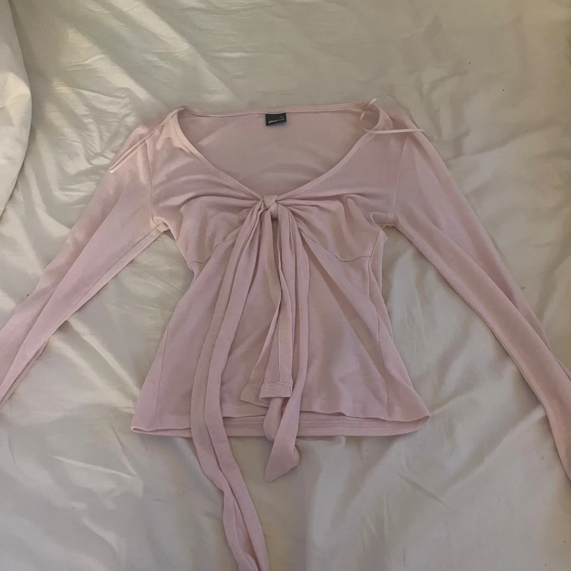 Ljusrosa omlottopp från Gina Tricot