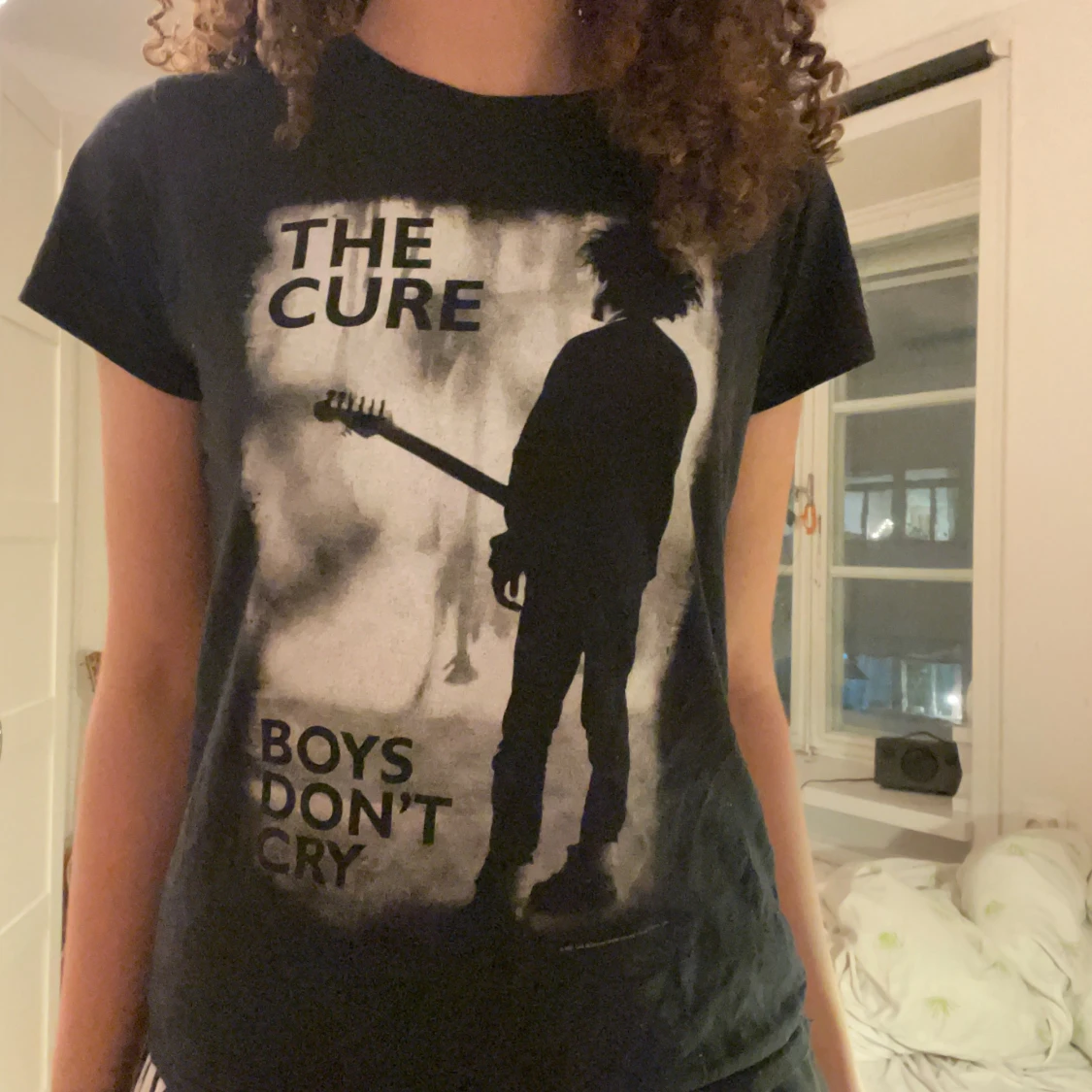 Svart t-shirt med The Cure-tryck