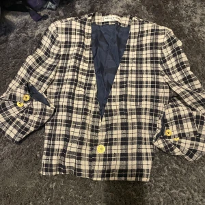 Sonia Rykel kavaj - Sonia Rykel kavaj i plaid. Figursydd med små axelvaddar. 