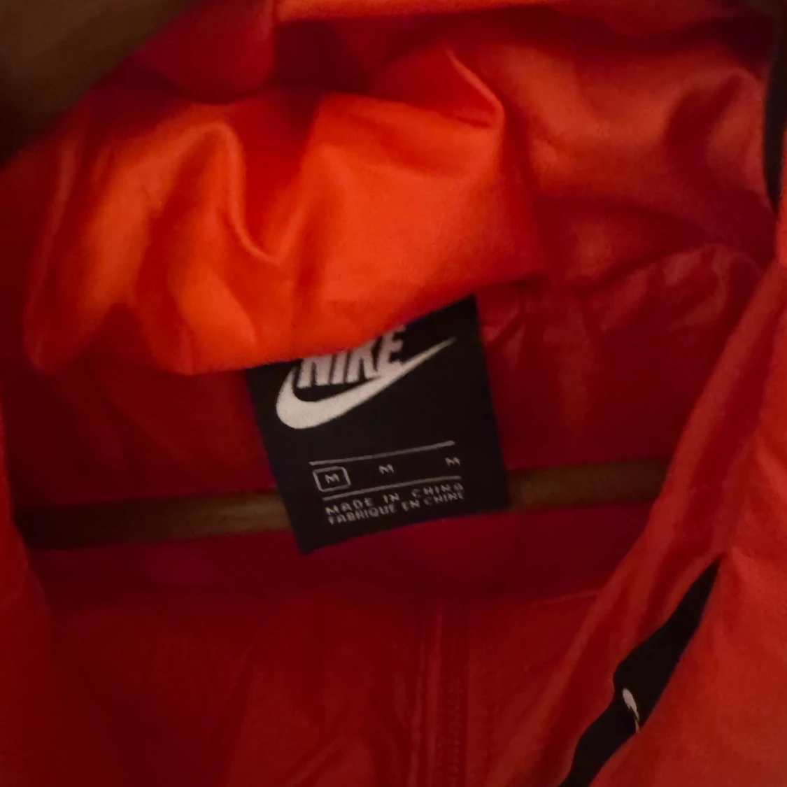 Orange pufferjacka från Nike - 91