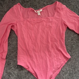 Rosa body - Aldrig använd. Bra skick