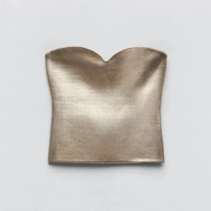 Guldig tubtopp - Supersnygg tubtopp från Zara, men köpt här på plick. Jättebra skick och endast använd ett fåtal gånger! 