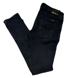 Nudie Jeans - Storlek: 30/32  Skick: 9/10 Modell: Tight Long John  Hör av er vid frågor och funderingar!
