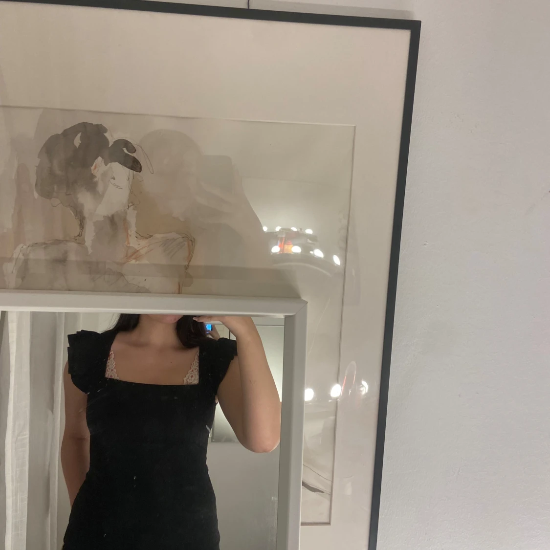 Svart T-shirt med spetsdetaljer