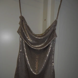gold top - Gorgeous gold halterneck top with an open back that can be worn in 2 ways. One of a kind handmade piece. Stretchy material, so it fits XS-M
