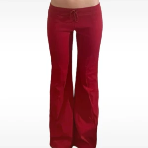 Röda lågmidjade utsvängda byxor - Storlek 38 bra skick