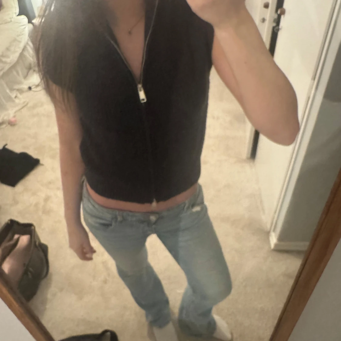 Stickad väst med dragkedja