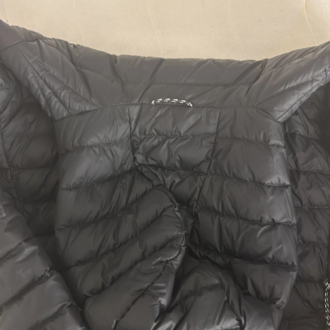 Svart/blå( beror på hur man upplever den) dunjacka från Peak Performance - 92