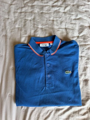 Lacoste sport pike  - Lacoste sport pike polo tröja, jättefin skick, använt några gånger pga passar inte i den längre