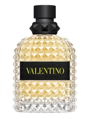 Valentino yellow  - Exklusiv parfym från Valentino i en transparent glasflaska med nitar och mönstrad yta. Flaskan har en svart etikett med gult texttryck och ett svart lock med nitar. Doften har en lyxig och modern känsla, perfekt för dig som gillar stilrena detaljer.